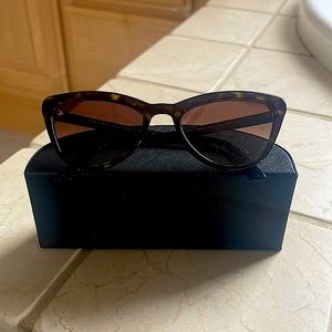 Prada cat eye sunglasses, worn only 4 times total. Condition is new.
